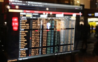 Financial market data screen illustrating AI investing risks in Tesla and SpaceX